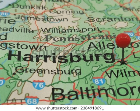 Red round tack on map of Harrisburg, PA.  This city is the capital of the Commonwealth of Pennsylvania.