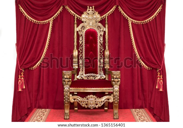 Red royal chair on a background of red curtains.\
Place for the king. Throne