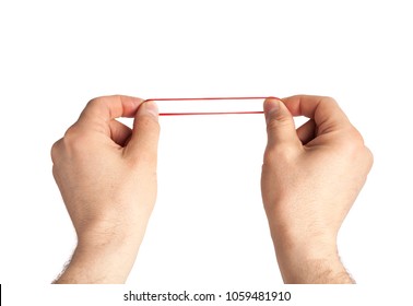 Red rubber band in hand. Elastic bands on hands.  dragging an elastic with hands. 