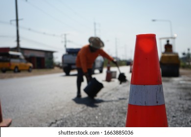 Red Rubber Cone In Road Construction And Background Blur