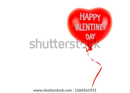 Red rubber inflatable heart shape balloon. Love, relationship, valentines day and birthday celebration concept. Studio shot on an abstract blurred background with blank copy space