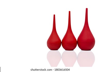 Red Rubber Syringe Ball Isolated On White Background. Nasal Aspirator. 
Baby Ear Syringe Ball. Snot Sucker And Mucus Sucker. Laboratory Tool. Rubber Suction Syringe Bulb. Ear Washing Squeeze Bulb.