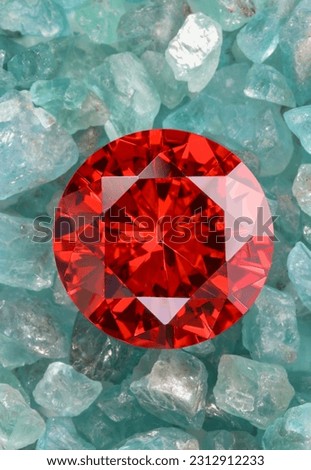 Red ruby diamond diamond on placed on a pile of raw sky blue gemstones.jewelry are lovely present for valentine daycolorful raw stone background.lived a life of luxury. 