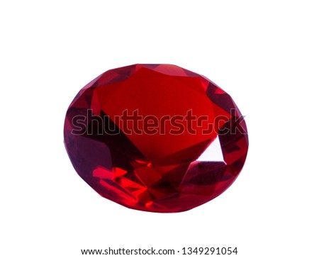 Red ruby gem close up. Isolated object on white background.
