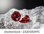 Red Ruby gemstone on stone background, close up shot
