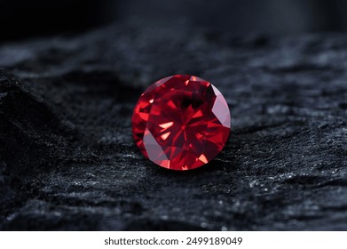 Red Ruby gemstone on stone background, close up shot
