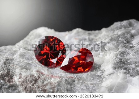 Red Ruby gemstone on stone background, close up shot