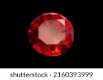 Red Ruby gemstone Round Cut isolate on Black background, close up shot