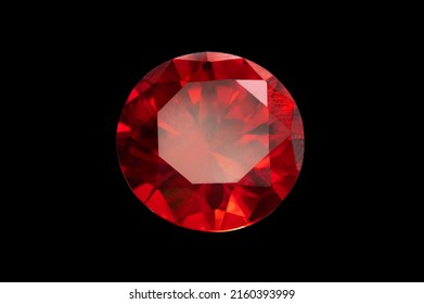 Red Ruby gemstone Round Cut isolate on Black background, close up shot