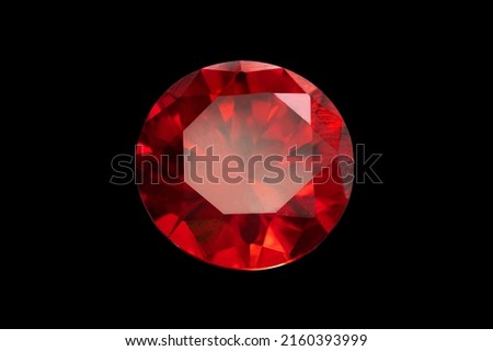 Red Ruby gemstone Round Cut isolate on Black background, close up shot