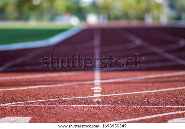 Red running sport track background and texture.\
Sport running track\
concept.