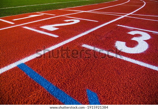 Red running sport track background and texture.\
Sport running track\
concept.