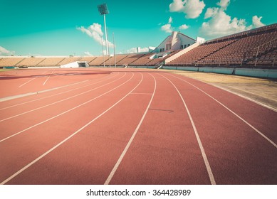 Red running track in stadium. 