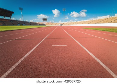 Red Running Track In Stadium. 