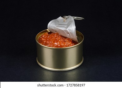 Red Salmon Caviar In Tin On Black Background