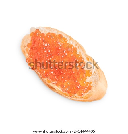 Red salty natural salmon caviar or fish roe on single slice loaf of bread or crusty canape with butter isolated on white background served for healthy breakfast full of protein, fat and vitamins