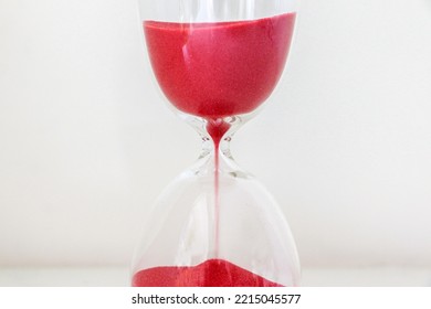 Red Sand Running Through The Bulbs Of An Hourglass, Counting Down Time, No Time Concept