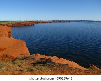 Red Sandstone And Clay Cliffs, Landscape Of Etang-du-Nord In Magdalene Islands, Iles De La Madeleine, Quebec, Canada