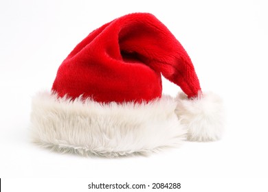 Red santa claus hat over white background - Shutterstock ID 2084288