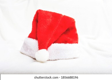 Red Santa Hat, Closeup, White Crumpled Blanket, Copy Space, Side View