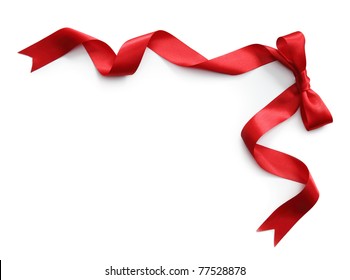 Red satin ribbon with bow isolated on white background - Shutterstock ID 77528878