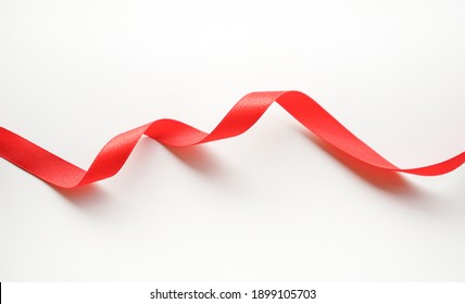 Red Satin Ribbon On White Background 