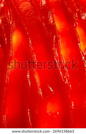 Red sauce splashes as background.