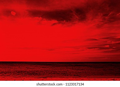 Red seascape with clouds