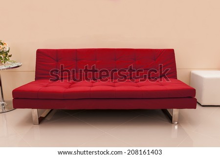 red seat decorated in pink room