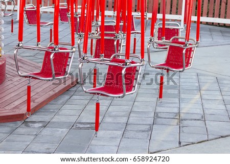 red seats of a carousel. close up