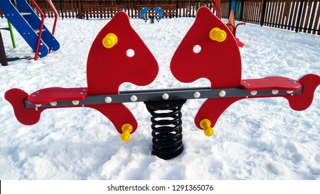 Red See Saw In A Playground