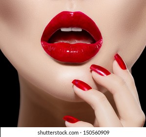 Red Sexy Lips And Nails Closeup. Open Mouth. Manicure And Makeup. Make Up Concept. Kiss 