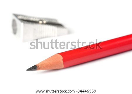 A red sharp pencil and a pencil sharpener
