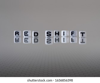 Red Shift Concept Represented By Wooden Letter Tiles