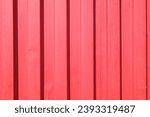 Red shipping container corrugated metal background, red color