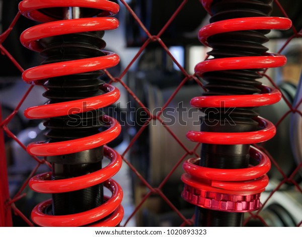 red shock absorbers of\
car.