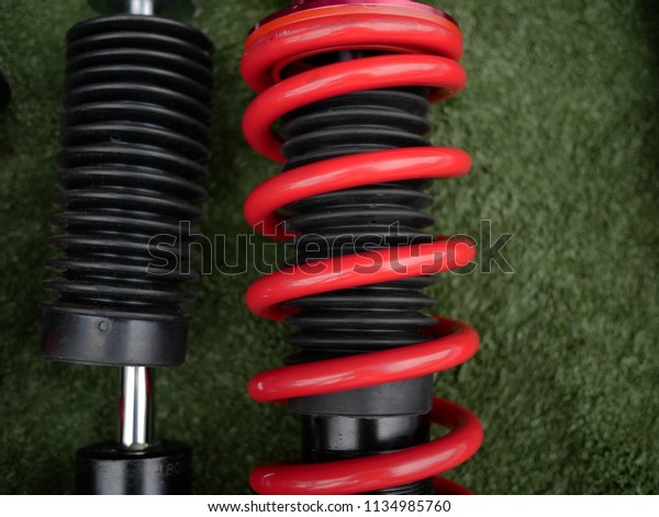 red shock absorbers of\
car.