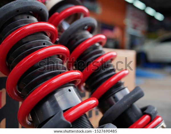 red shock absorbers of\
car at garage.