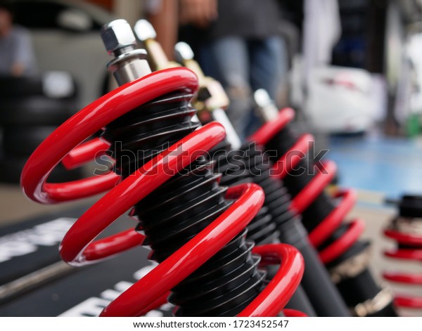 red shock absorbers of
car at garage.