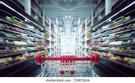 Red Shopping Cart With Motion Speed Blurred 
Supermarket Aisle Background .