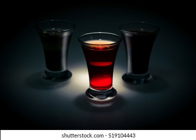 Red Shot Glass On A Dark Background In The Spot Light