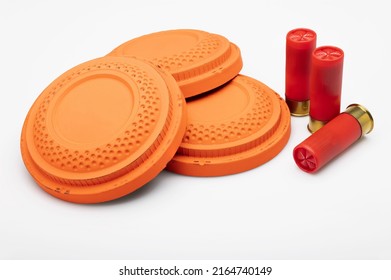 Red Shotgun Shell And Clay Pigeon Target On White Background , Gun Shooting Game