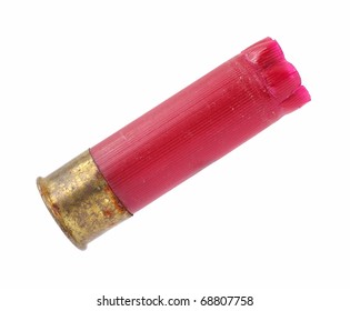 A red shotgun shell that has been fired on a white background.