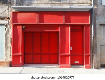 Red showcase with blank billboard in a closed store