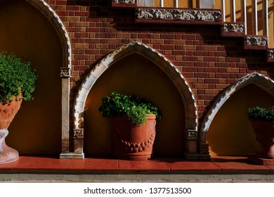 Red Sidewalk With Large Flower Pots And A Stairwell - Powered by Shutterstock