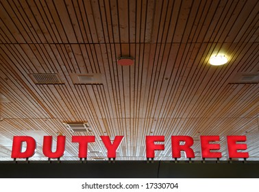 Red sign at an airport, reading "Duty Free"