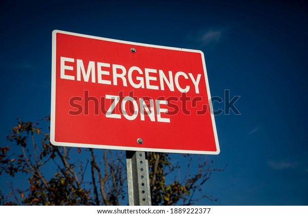 Red Sign White Letters Stating Emergency Stock Photo 1889222377