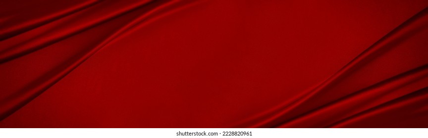 Red silk satin. Luxury background with space for design. Banner. Wide. Long. Panoramic. Flat lay, top view table. Template. Christmas, New Year.