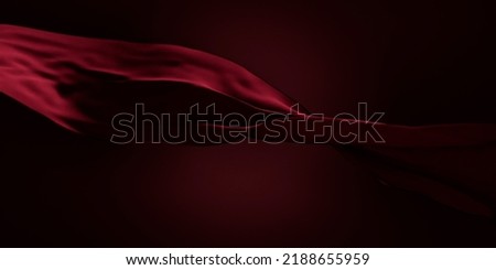 Red silk scarf flow in front of black background. Abstract fabric curve flying on dark backdrop. Elegant fashion and beauty magazine mockup design. Classy cloth material drapery veil.