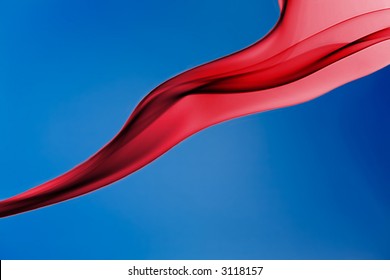Red silky shape against sky blue